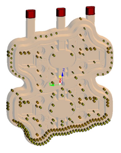 Fig. 2: Para el diseño inicial, los expertos colocaron tres boquillas de disparo (en rojo, arriba)   y filtros en la caja del macho (marcados en amarillo).  